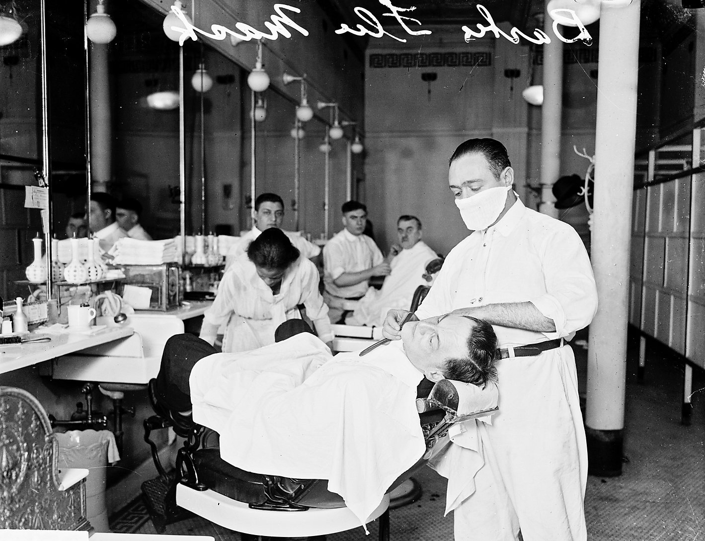 black and white image of a barbershop in 1918