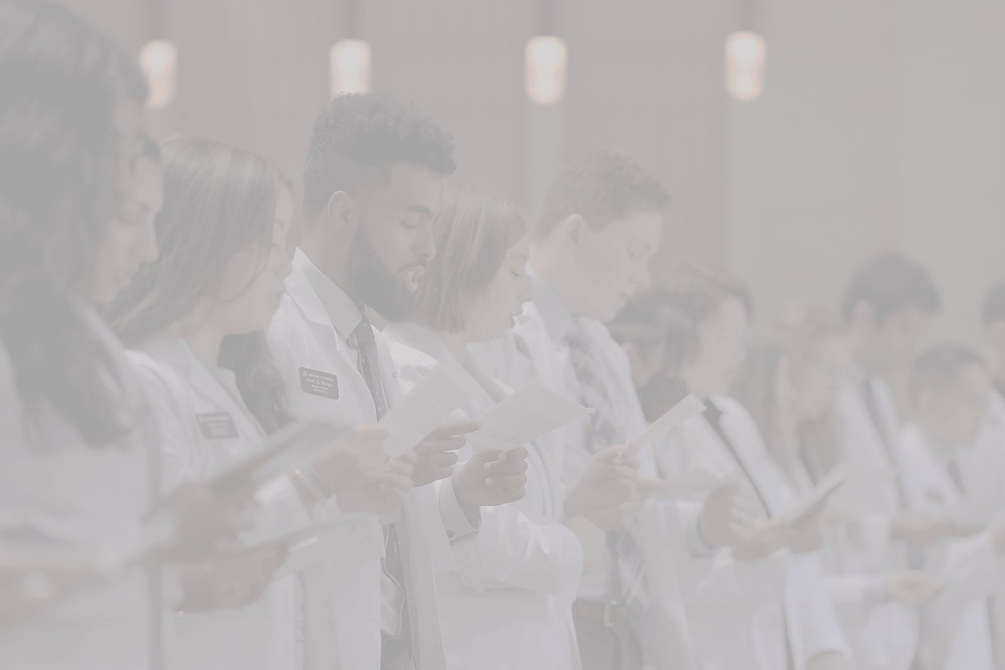 Students of the University of Minnesota Medical School reciting an oath at the annual white coat ceremony.