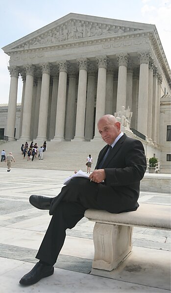 Robert (Bob) Levy sits outside the Supreme Court.