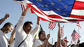 Media Name: flag-and-immigrants1.jpg