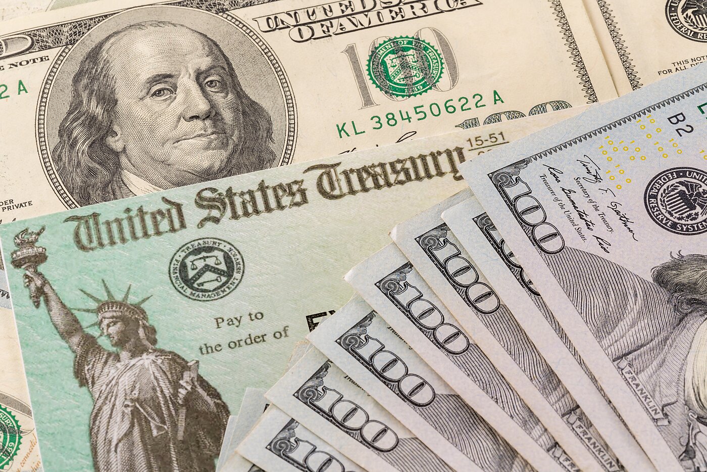 US Treasury check with hundred dollar bills
