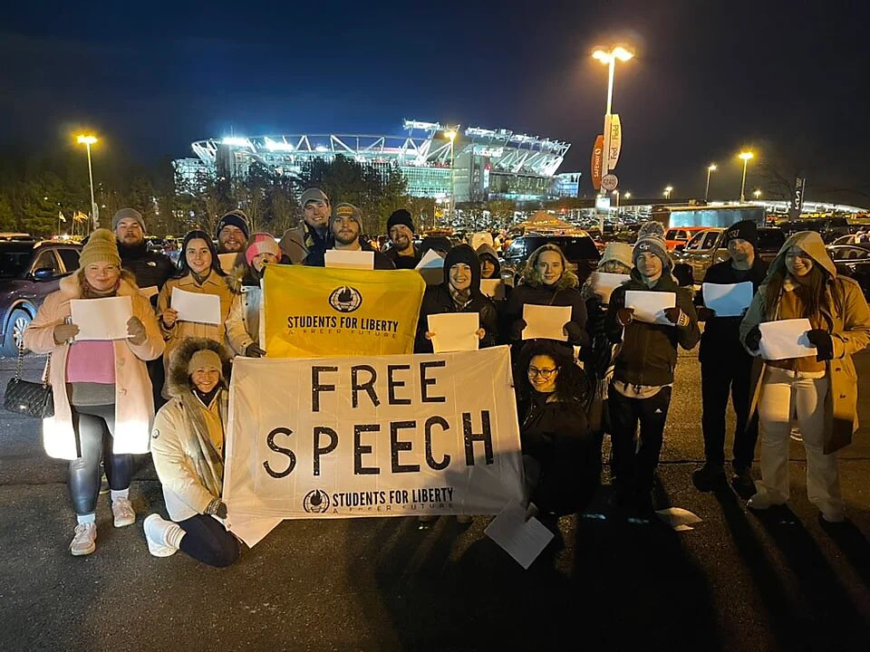 SFL protesters with banner outside of NFL game