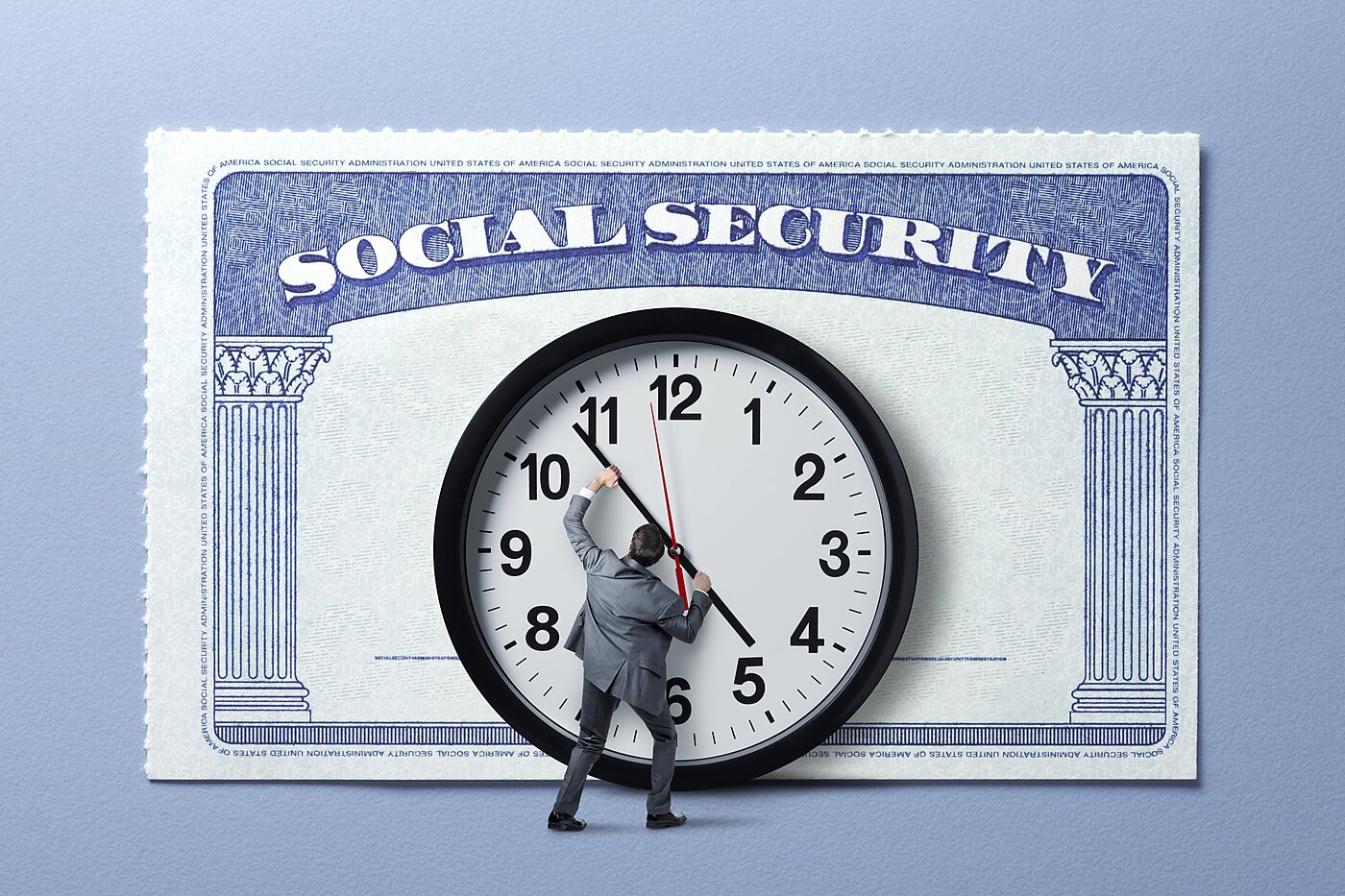 Man holding back hands of a clock in front of Social Security card