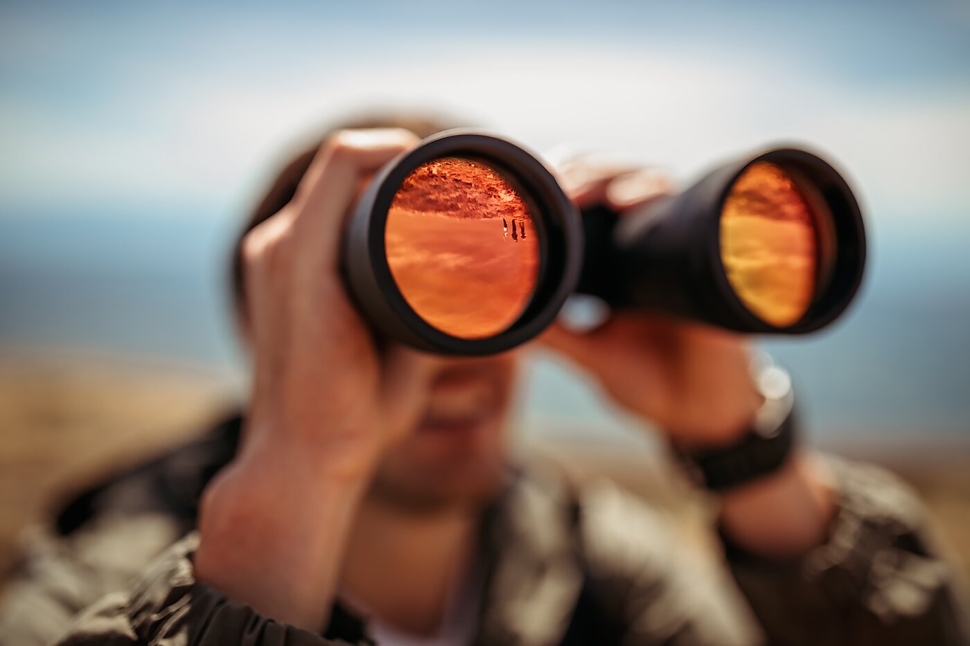 Man looking in binoculars